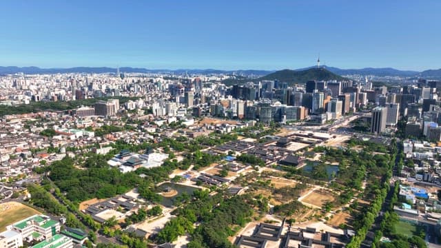 Vast cityscape with a mountain in the background