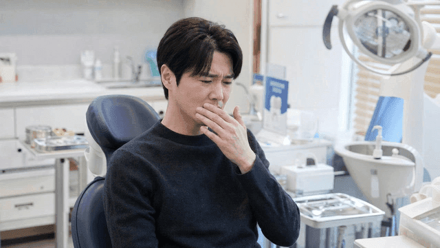 Male patients experiencing discomfort at dental clinic