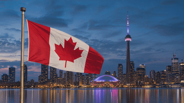 Canadian flag waving with city skyline