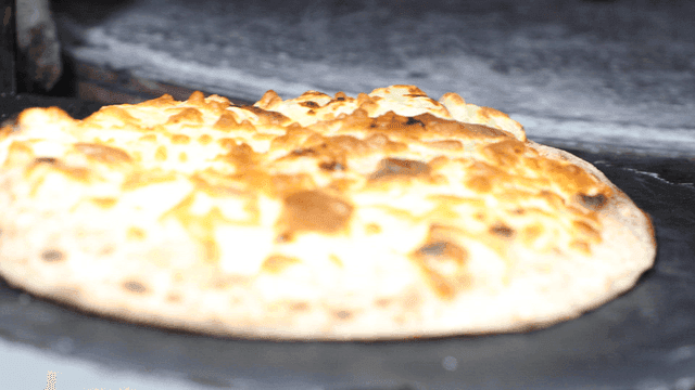 Pizza taken out of hot oven