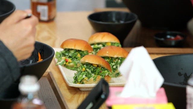 Spring cabbage coleslaw sandwich on the dining table