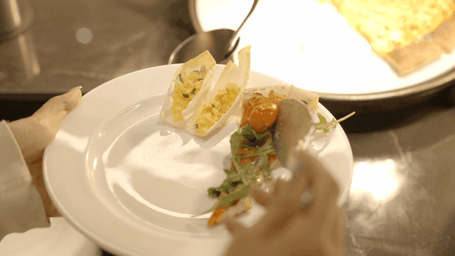 A plate with salad and pizza slice