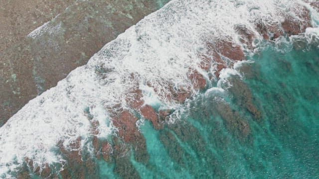 Waves crashing on a sandy beach