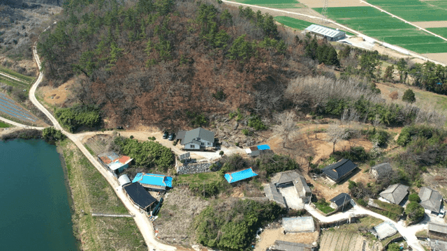 Rural village surrounded by fields and forests