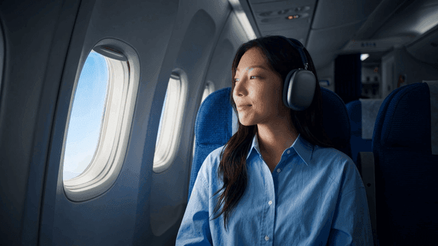 Woman enjoying a flight with headphones