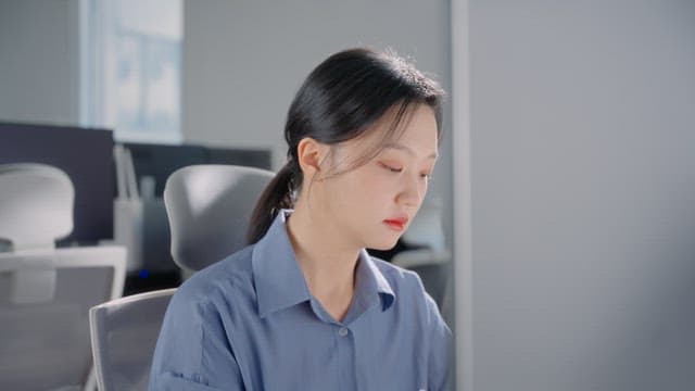 Woman working at a desk in an office