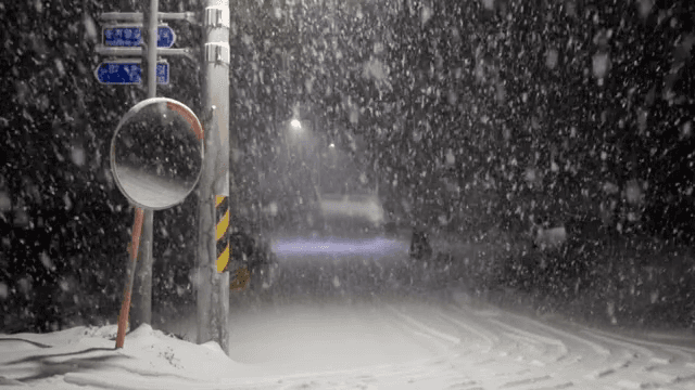 Snowy night at a street corner