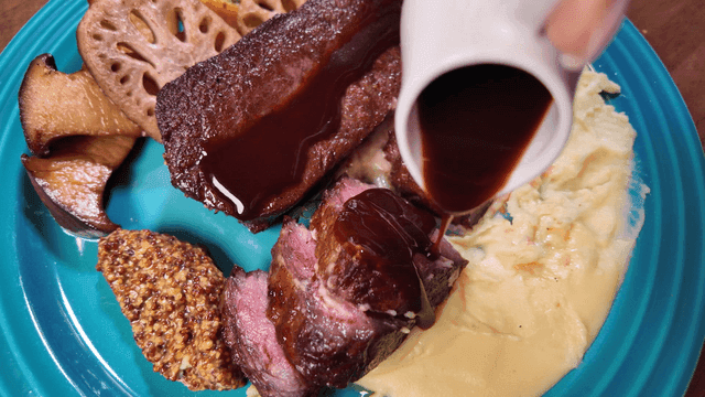 Steak drizzled with barbecue sauce