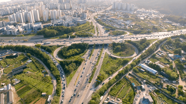 Highway interchange connecting agricultural area and city