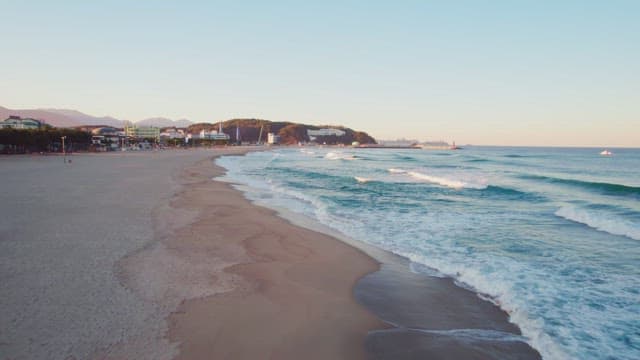 Waves crashing on a sandy beach