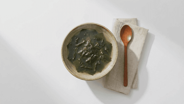 Seaweed soup placed with spoon