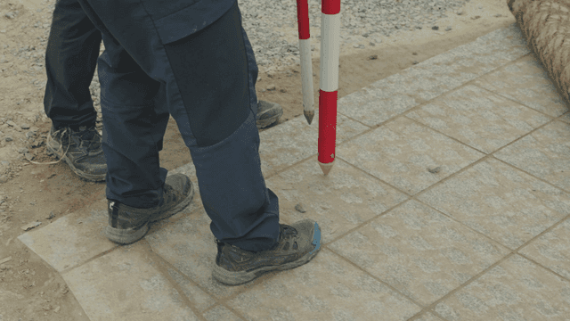 Workers marking a construction site