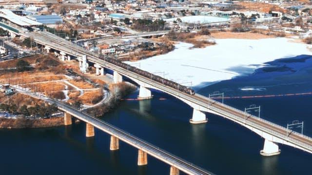 Train Crossing a Frozen River in Winter