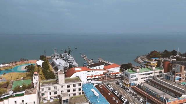 Coastal village with amusement park and sea