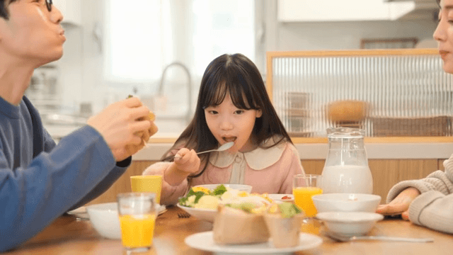 Family enjoying breakfast together