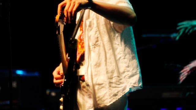 Musician Playing Electric Guitar On Stage