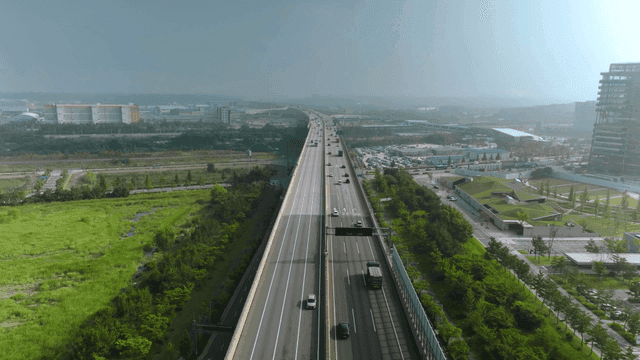 Highway cutting across plains landscape