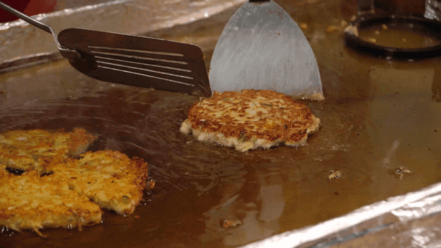 Mung bean pancakes fried on iron plate