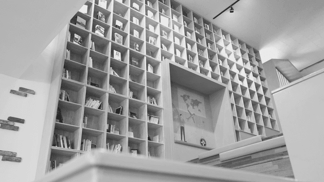 A modern library with tall bookshelves