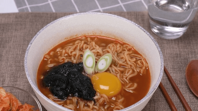 Spicy ramen topped with egg and spicy sauce