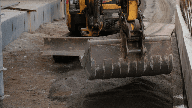 Construction site with excavator moving soil