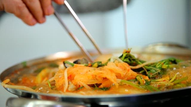 Kimchi stew with puffer fish boiling in a pot