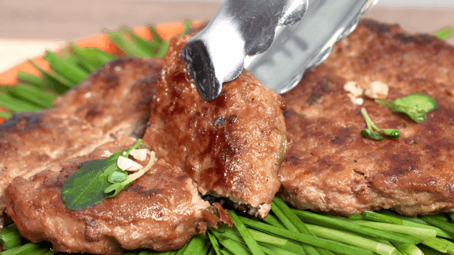 Grilled tteokgalbi on top of vegetables