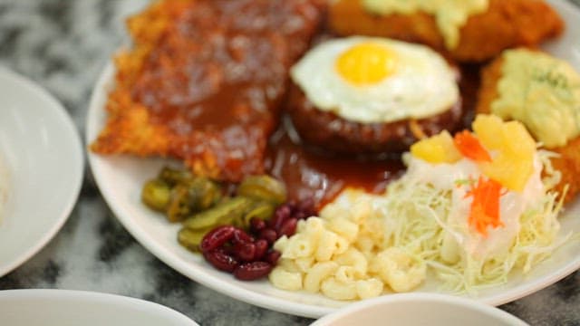 Plate of assorted pork cutlets and salad