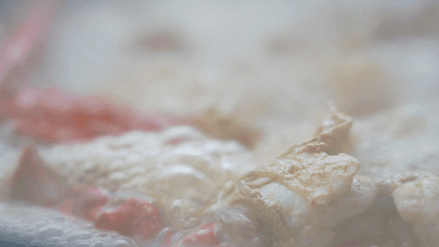Crab stew boiling in a steaming pot