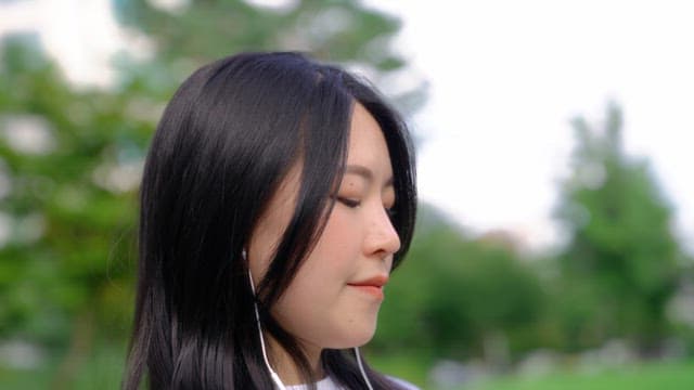 Woman enjoying a peaceful moment outdoors