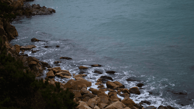 Rocky shoreline with gentle waves