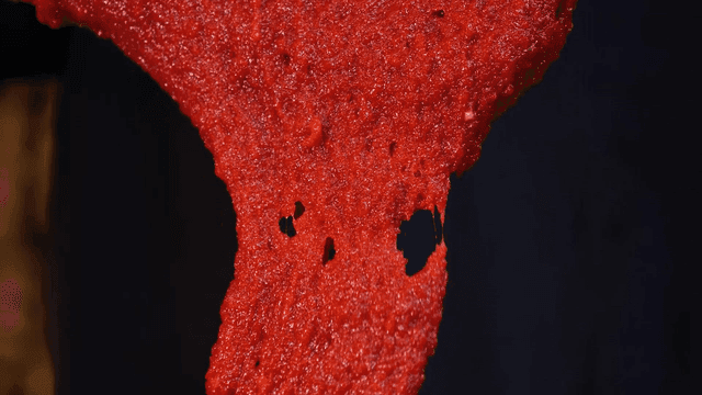 Thick red chili paste dripping slowly