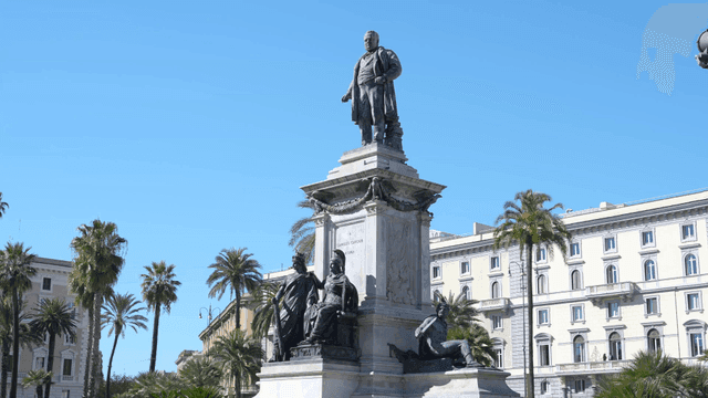 A historic statue in a sunny plaza