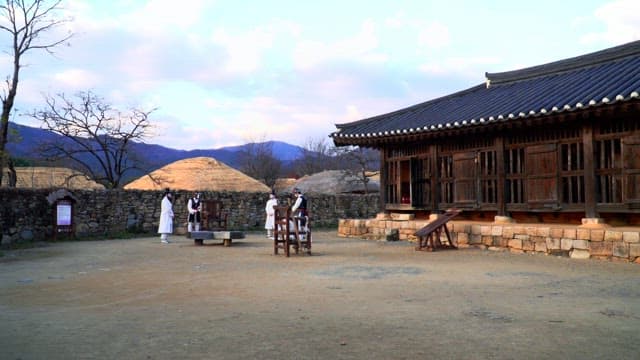 Traditional Korean village with model of people in hanbok