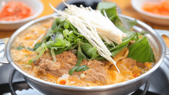 Pork backbone stew with perilla leaves and enoki mushrooms