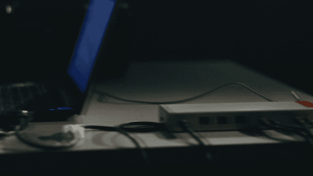 Investigators analyzing lie detectors on laptops