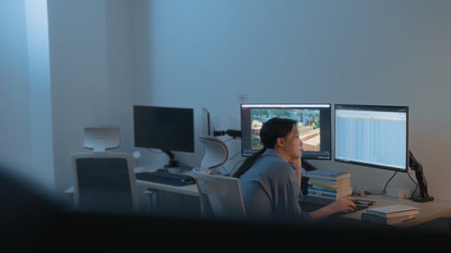 Woman working late at an office desk