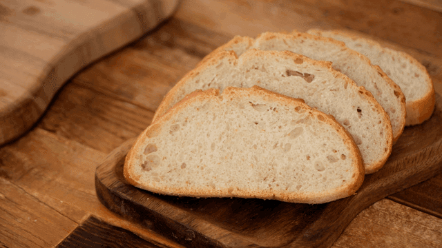 Sliced bread on a wooden cutting board