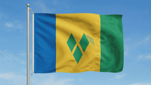 Saint Vincent and Grenadines flag fluttering under clear sky