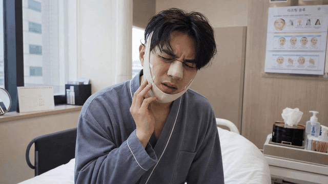 Plastic surgery ward with man with bandages on his face