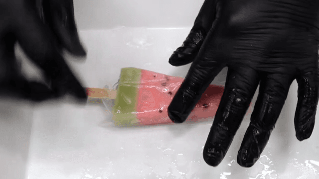 Wrapping watermelon-shaped ice cream in rice paper