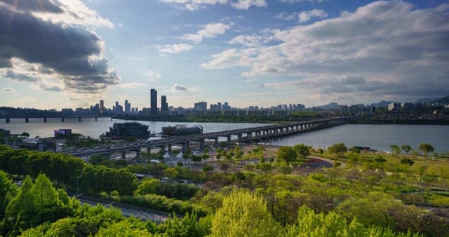 Panoramic view of the Han River and Seoul from daytime to evening