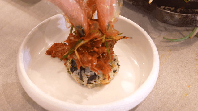 Spicy braised crunchy pork ribs served on rice balls