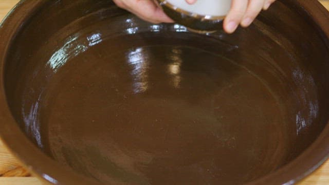 White flour paste poured into a traditional bowl