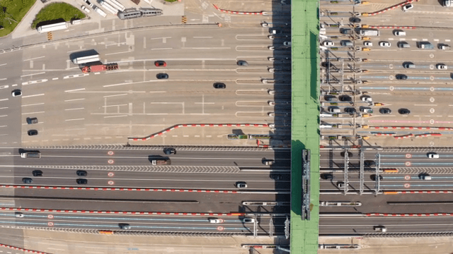 Busy highway with multiple lanes and cars