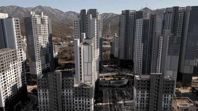 Modern high-rise buildings with mountains