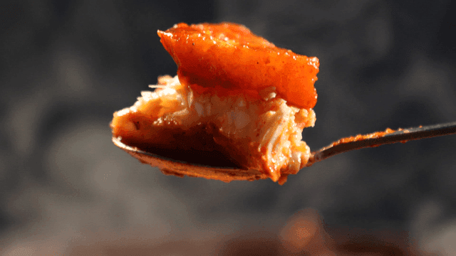 Spicy braised raw fish and radish on spoon