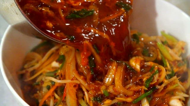 Delicious spicy soup poured over noodles