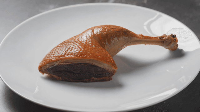 Piece of well-roasted duck leg