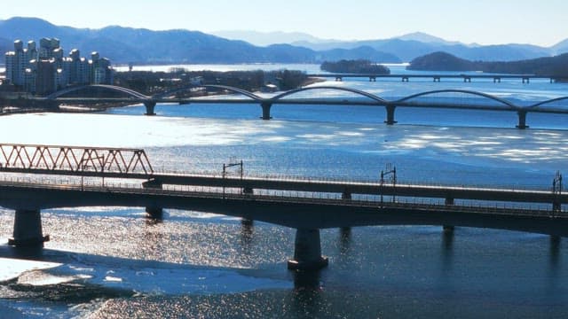 Winter view of bridges over a frozen river